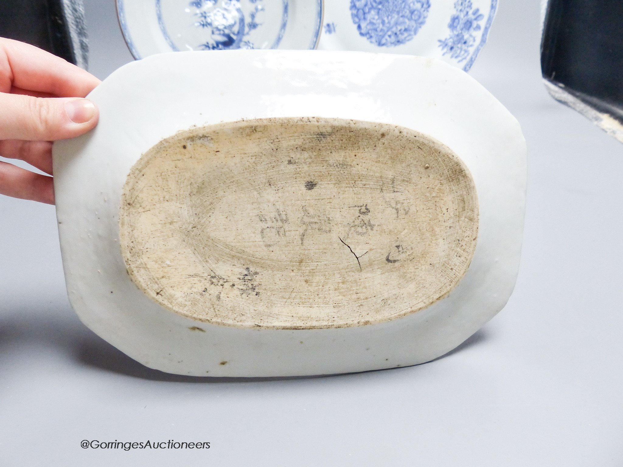 Two 18th century Chinese circular export plates and two canted rectangular dishes, 32 x 23cm